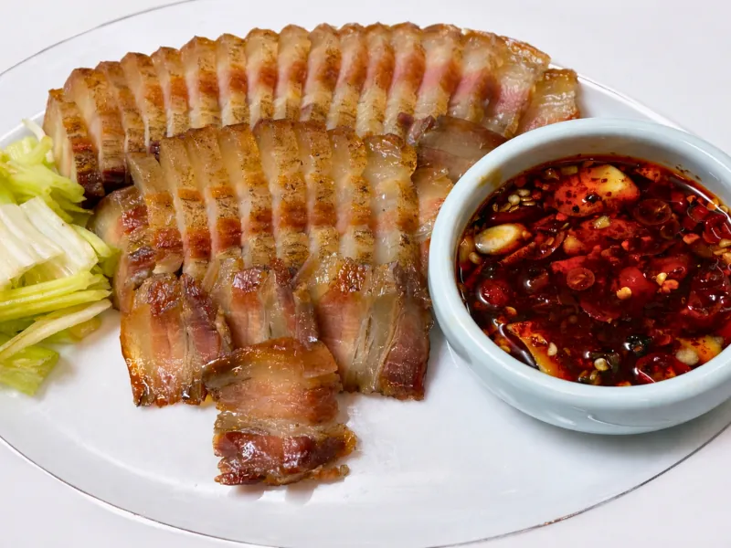 Smoky dry-cured pork served with spicy dipping sauce at Chef Zhang Cuisine & Bar, a Chinese Restaurant in Cambridge