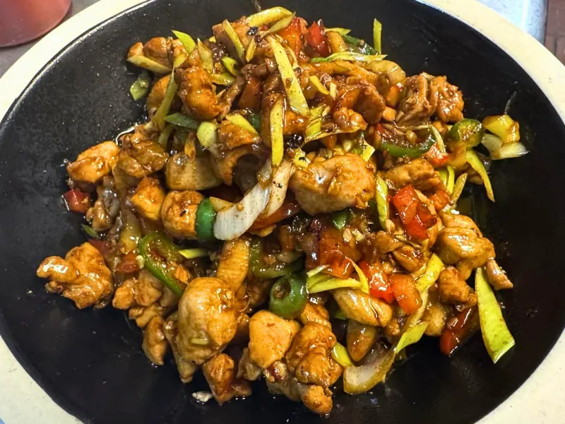 Spicy chicken stir-fry with peppers at Chef Zhang Cuisine & Bar, a Chinese Restaurant in Cambridge