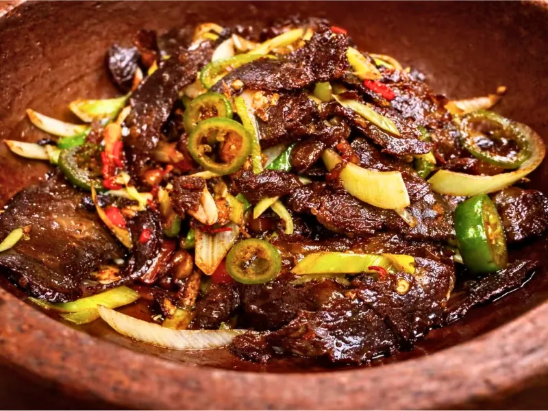 Cured pork stir-fried with garlic greens at Chef Zhang Cuisine & Bar, a Chinese Restaurant in Cambridge